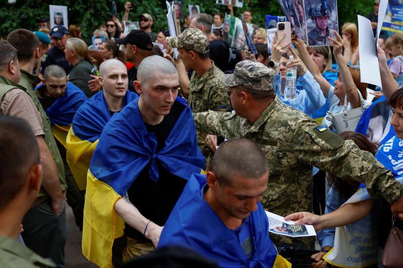 Soldiers return home after years in captivity as Ukraine-Russia prisoner swap begins