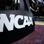 College basketball coach escorted off court in handcuffs: What we know