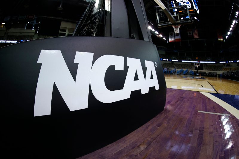 College basketball coach escorted off court in handcuffs: What we know